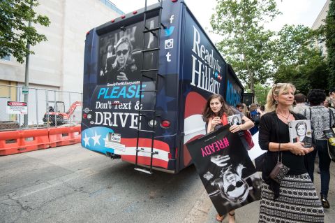 Supporters of former Secretary of State Hillary Clinton stand near a Ready for Hillary bus after Clinton spoke about her book "Hard Choices." The "Ready for Hillary" slogan quickly became popular through the Ready for Hillary Super PAC, urging Clinton to run for president.