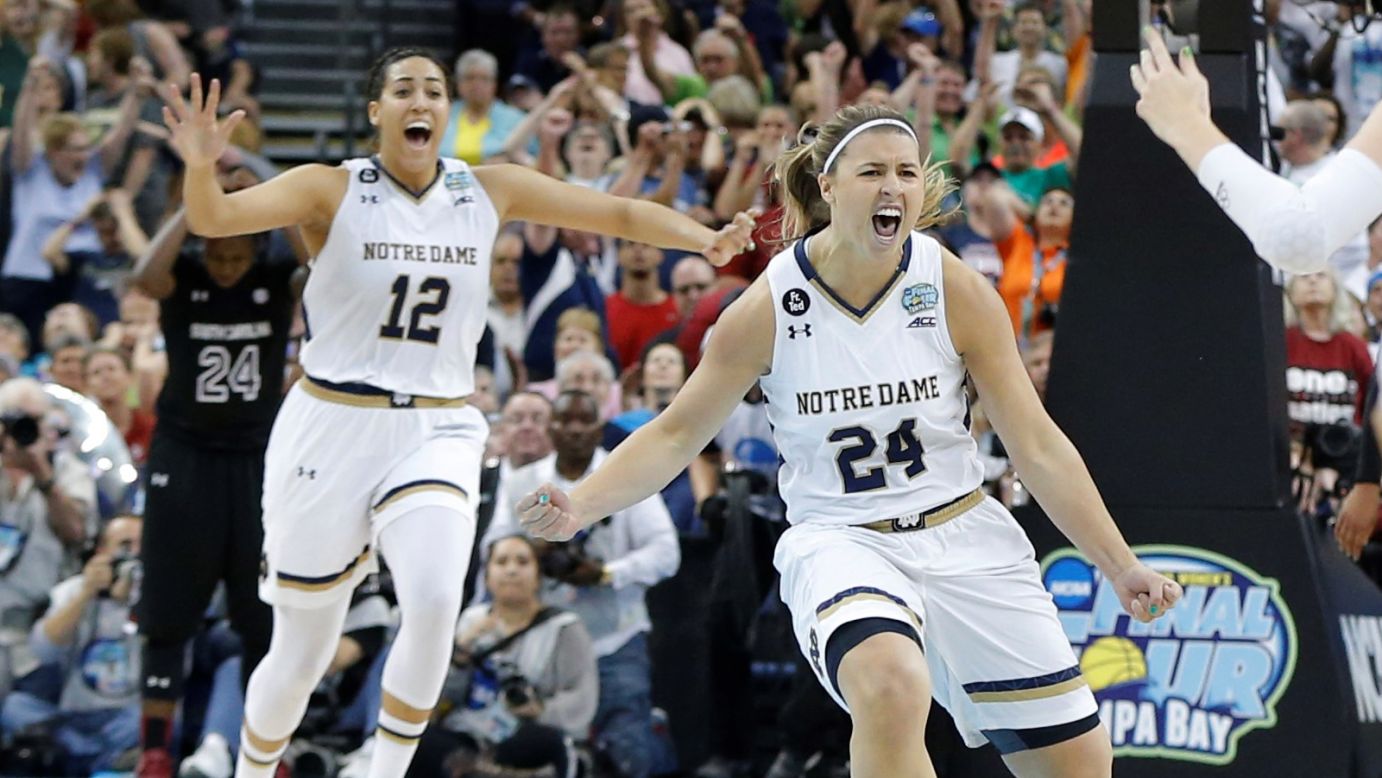Taya Reimer, left, and Hannah Huffman celebrate after Notre Dame defeated South Carolina 66-65 in a national semifinal played Sunday, April 5, in Tampa, Florida. Notre Dame advanced to the final against UConn, setting up a rematch of last year's final.