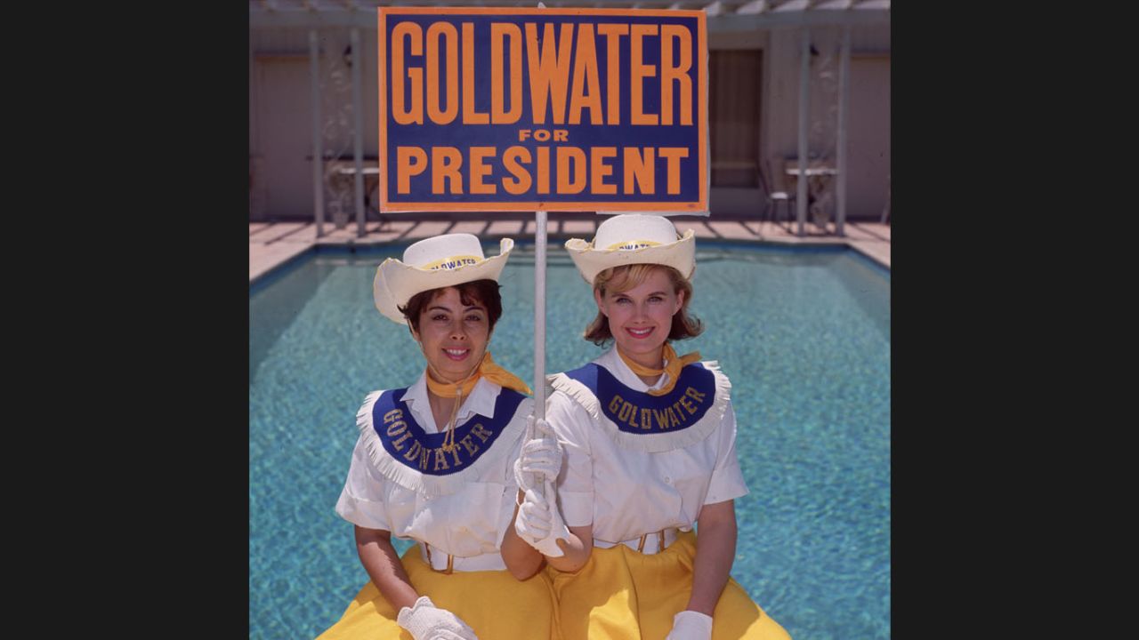 Two "Goldwater girls" in July 1964 in Sherman Oaks, California, campaign for Barry Goldwater, the Republican candidate for president. Goldwater's campaign slogan was, "In Your Heart You Know He's Right."