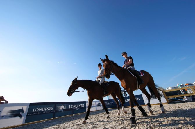 Horses prepare for the rigors of a day's competition in air-conditioned stables.