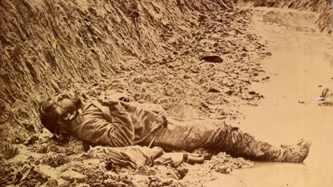 A dead Confederate soldier in the trenches of Fort Mahone in front of Petersburg, Virginia, on April 3, 1865.