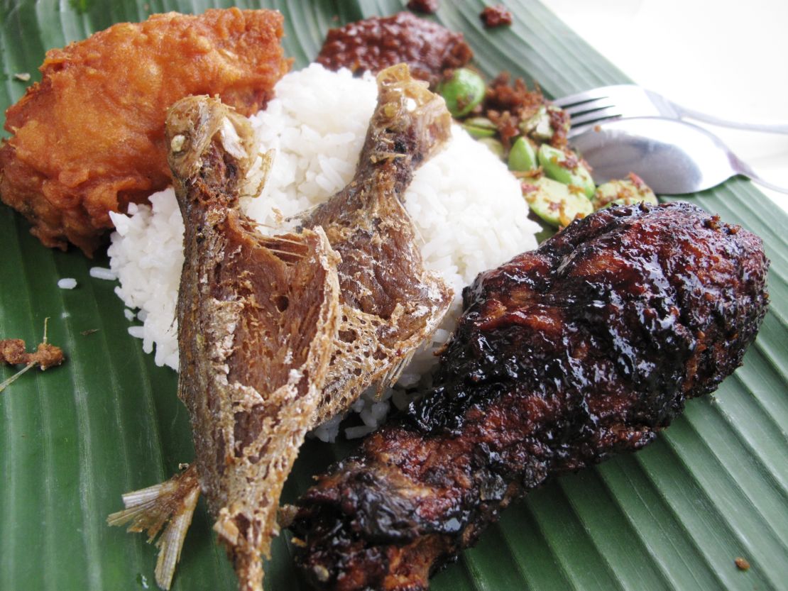 Sweet crispy black chicken over coconut rice and spicy sambal.