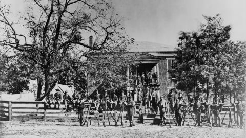 Union soldiers pose in April 1865 in front of Appomattox Courthouse.
