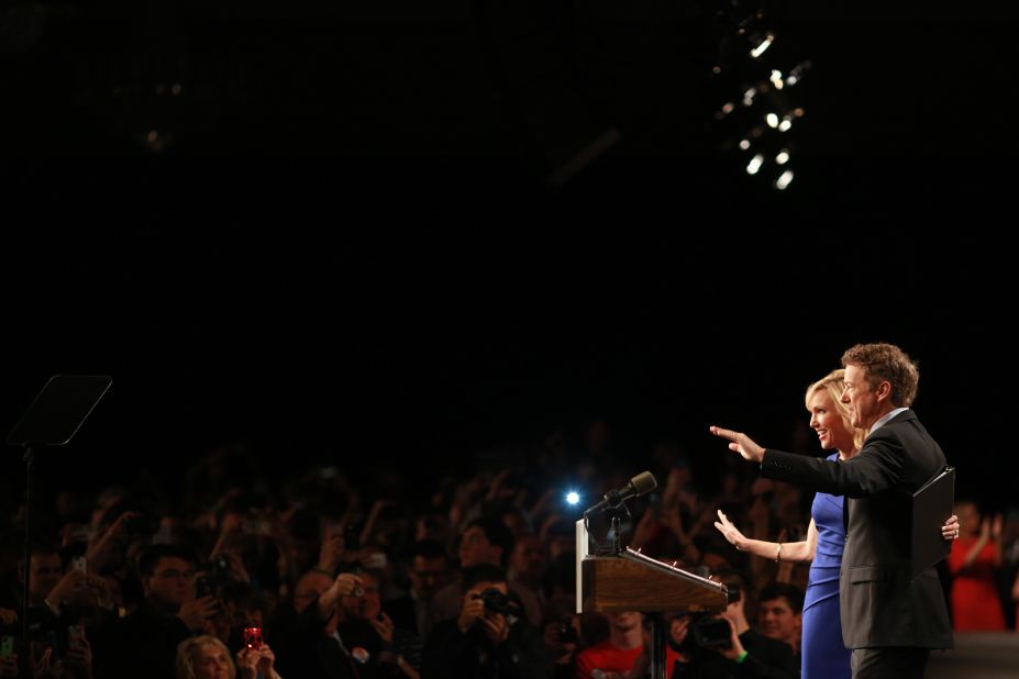 Paul and his wife, Kelley, wave to supporters in Louisville on April 7.