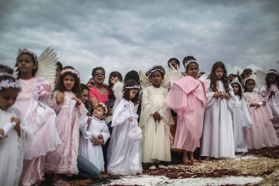 APRIL 7 - OURO PRETO, BRAZIL: Girls dressed as angels take part in the annual Easter procession during traditional Semana Santa (Holy Week) festivities. Holy Week marks Easter celebrations for Catholics and<a href="http://www.pewforum.org/2013/07/18/brazils-changing-religious-landscape/" target="_blank" target="_blank"> Brazil holds the largest number of followers of the faith.</a>