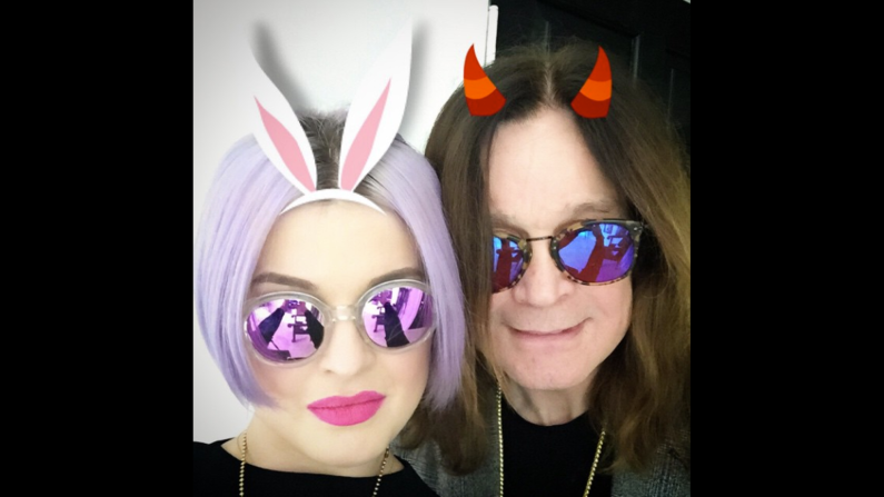 Singer Kelly Osbourne posted a digitally altered selfie with her father, legendary rocker Ozzy Ozbourne, on Sunday, April 5. "Dad insisted on the devil horns!" <a href="https://instagram.com/p/1Gy-sgAb74/" target="_blank" target="_blank">she said on Instagram.</a> "#HappyEaster." 