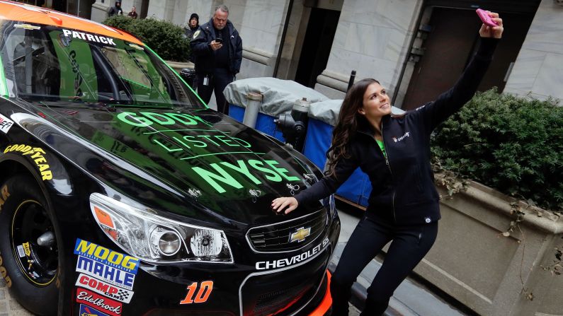 NASCAR driver Danica Patrick snaps a selfie with her car in front of the New York Stock Exchange on Wednesday, April 1. Patrick's sponsor GoDaddy was making its debut on the stock exchange.