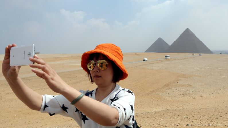 A tourist takes a selfie in front of the pyramids of Giza, Egypt, on Thursday, April 4. <a href="http://www.cnn.com/2015/04/01/living/gallery/selfies-look-at-me-0401/index.html" target="_blank">See 27 selfies from last week</a>