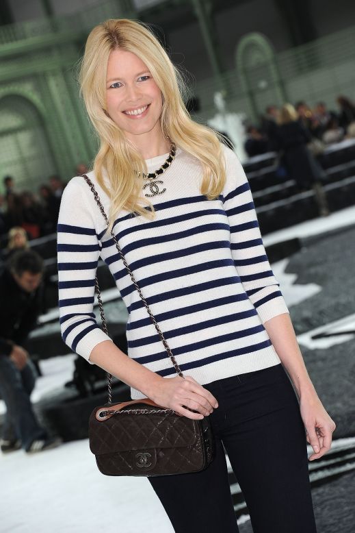 Decades after Chanel first sported the nautical look, model Claudia Schiffer wears a blue and white striped top at the Chanel show, during Paris Fashion Week in 2010.