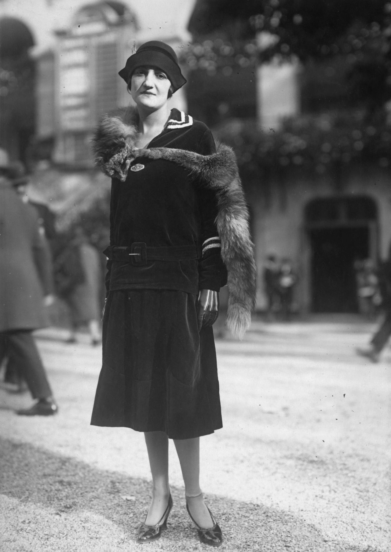 While this lady dresses up a velvet sailor-style dress and jacket with a fur stole, in 1925. 