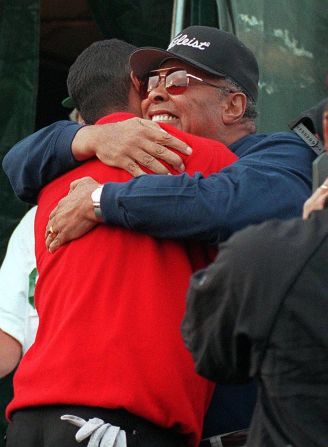 Woods is hugged by his father in 1997 after winning the Masters for the first time. Earl Wood would see his son don the prestigious green jacket on three more occasions before he passed away in 2006, aged 74 -- three weeks after that season's opening major, where Tiger tied for third as he sought to defend his Masters title.