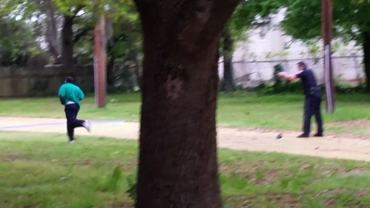 This still, released by the family of Walter Scott, shows police officer Michael Slager shooting Scott in the back as he ran away on April 4, 2015, in North Charleston, South Carolina. Slager was convicted of 2nd-degree murder and sentenced to 20 years in prison.