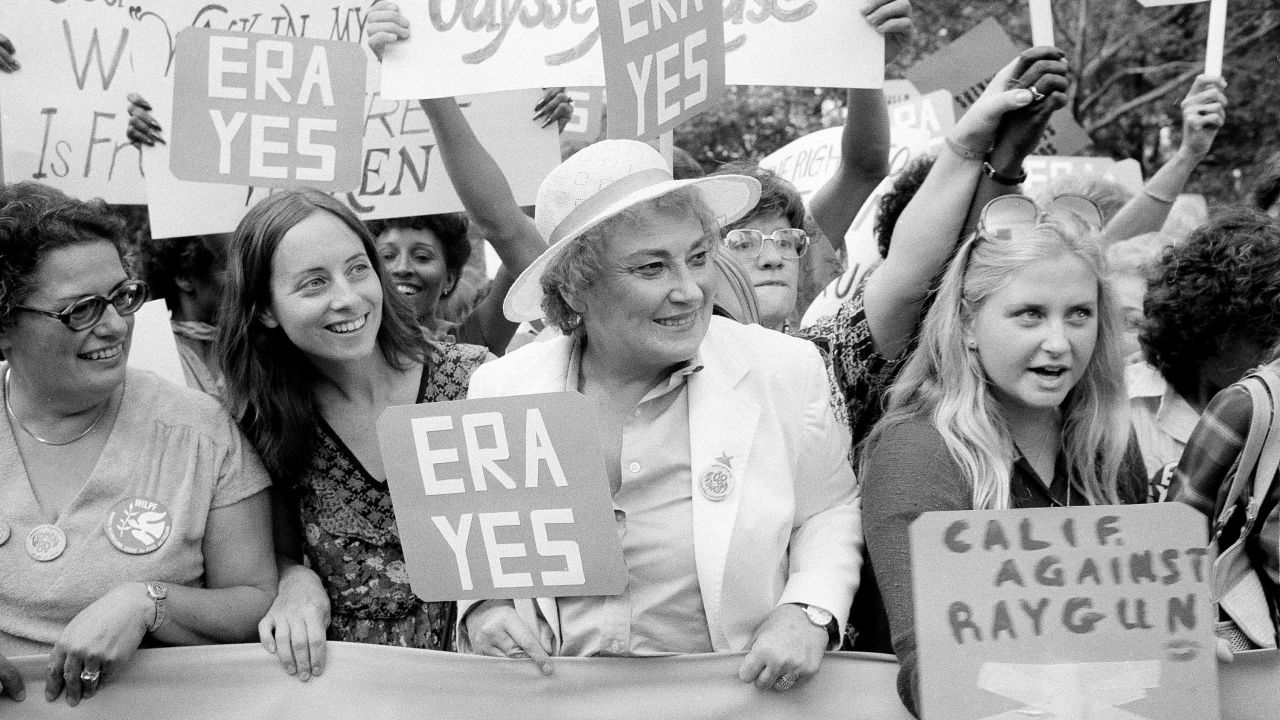 Bella Abzug, center, smiles as she holds up an ERA sign on New York's Fifth Avenue in 1980 to celebrate the 60th anniversary of women receiving the right to vote. In its 1998 obituary, The New York Times called Abzug, who represented Manhattan in Congress in the 1970s, a "founding feminist" and an icon of the movement, along with Betty Friedan and Gloria Steinem.