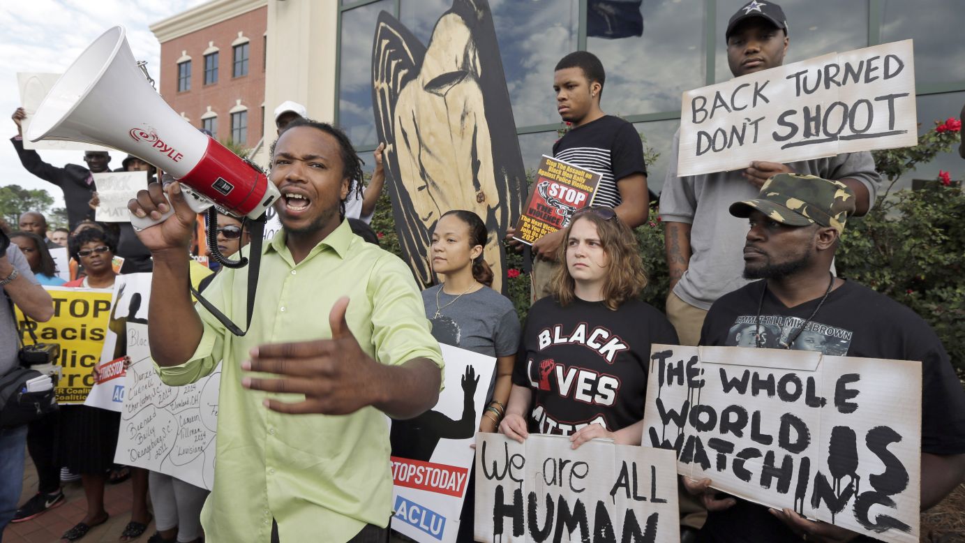 People protest Scott's shooting as they rally outside North Charleston's City Hall on April 8.