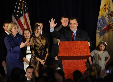 Christie waves to supporters with Lt. Gov.-elect Kim Guadagno, left, on November 3, 2009, in Parsippany, New Jersey. Christie defeated incumbent Democrat Jon Corzine.