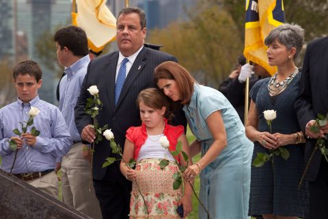 Christie and his family lay white roses on wreckage pulled from Ground Zero during the dedication of the Empty Sky Memorial for 9/11 at Liberty State Park in Jersey City, New Jersey, on September 10, 2011.