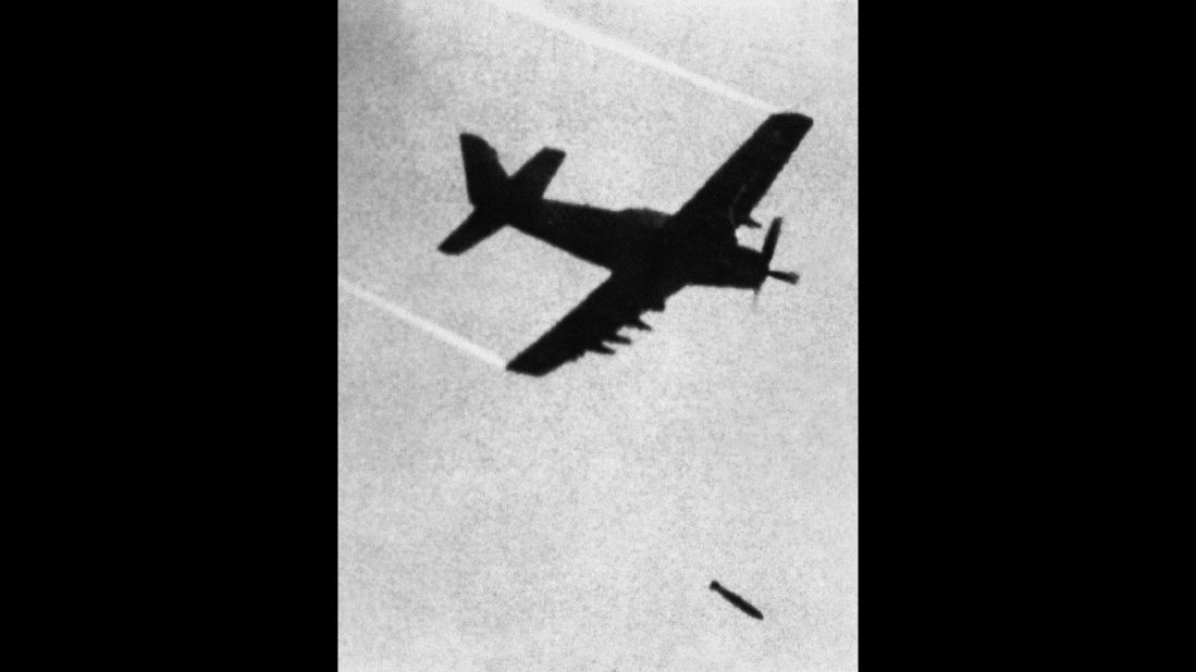 In this June 8, 1972, photo taken by Associated Press photographer Nick Ut, a South Vietnamese plane drops a napalm bomb over Trang Bang village, which had been occupied by the North Vietnamese during the Vietnam War. Ut was only 21, but he was already a seasoned war photographer when he arrived at the village as it was being bombed. It was there that he took these photos -- one of which has come to define the Vietnam War. The photos are in chronological order.