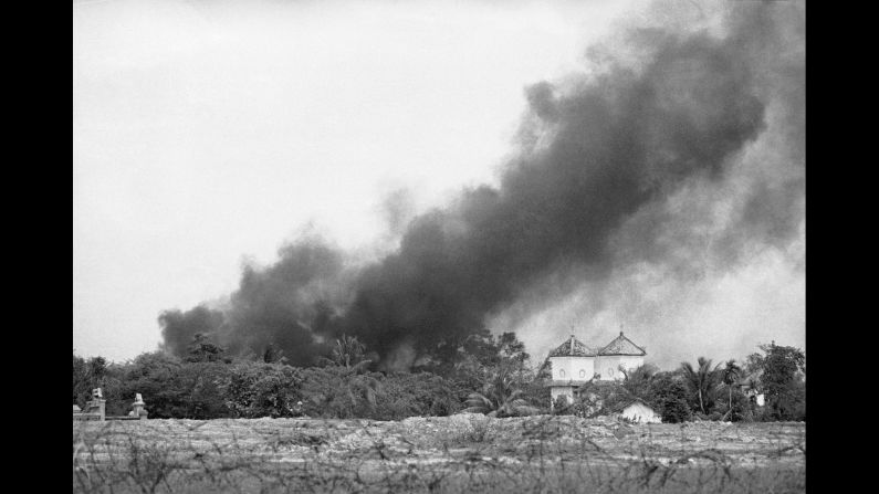 Smoke from a napalm bomb rises over a Trang Bang church.