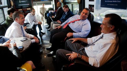 Christie and Republican presidential candidate Mitt Romney speak with Romney adviser Bob White on board the Romney campaign bus in Mount Vernon, Ohio, on October 10, 2012.