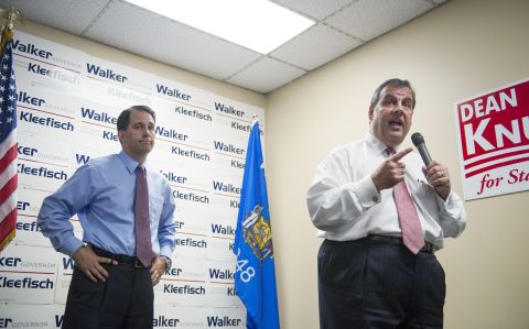 Christie campaigns for Wisconsin Gov. Scott Walker during a campaign stop at the GOP field office in Hudson, Wisconsin, on September 29, 2014.