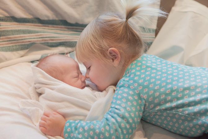 CNN invited readers last year to share photos of children with their new siblings. Here, Cecelia, 2, meets baby Sullivan. "Cece is very possessive of her little brother. 'He's mine' or 'my brother' or 'my Sully' are her favorite things to say to strangers when we are out together in public." -- <a href="http://ireport.cnn.com/docs/DOC-1231966">Cary Chadwick</a>, Higganum, Connecticut 