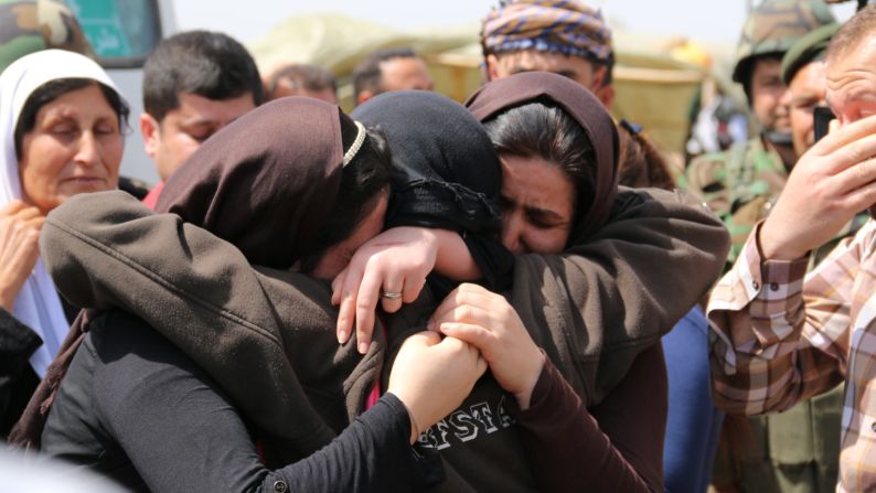 Yazidis embrace after being released by ISIS south of Kirkuk, Iraq, on Wednesday, April 8.<a href="index.php?page=&url=http%3A%2F%2Fwww.cnn.com%2F2015%2F04%2F08%2Fworld%2Fisis-yazidis-released%2F"> ISIS released more than 200 Yazidis</a>, a minority group whose members were killed, captured and displaced when the Islamist terror organization overtook their towns in northern Iraq last summer, officials said.