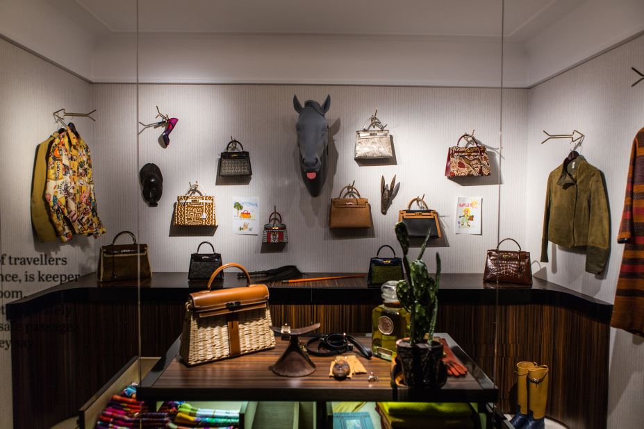 Where would the urban explorer be without her collection of Kelly bags? (The mounted horse head seems to be in on the joke.)