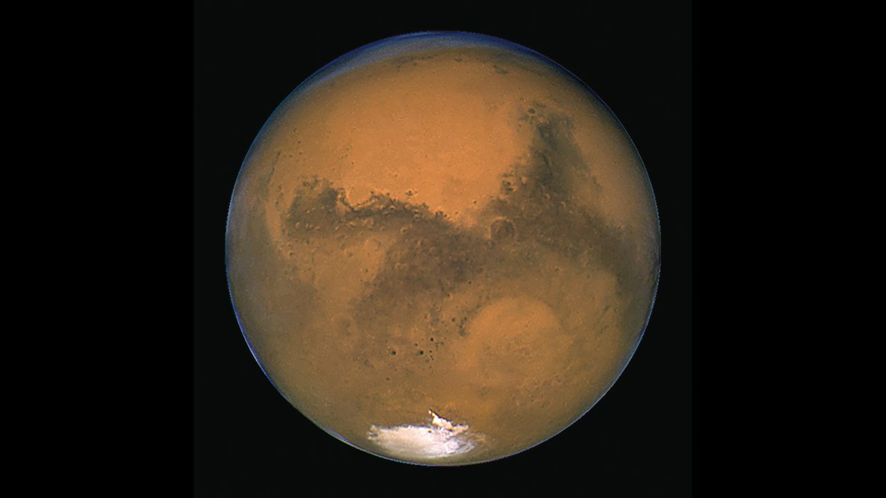 Hubble has given us many images of our neighbor Mars. This image was taken in 2003 when Mars made its closest approach in nearly 60,000 years. On August 27, 2003, the two worlds were only 34.6 million miles apart from center to center. By contrast, Mars can be about 249 million miles away from Earth.