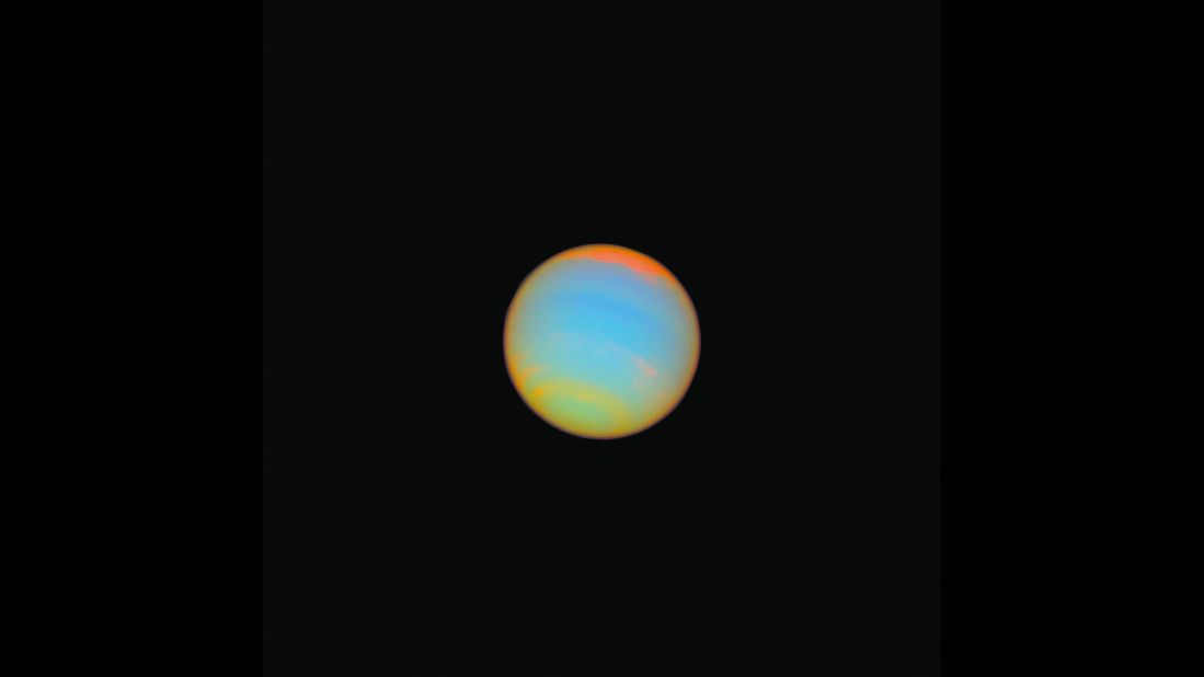 Hubble captured this image of the distant blue-green world Neptune in 2005. Fourteen different colored filters were used to help scientists learn more about Neptune's atmosphere. Neptune is about 2.8 billion miles from Earth.