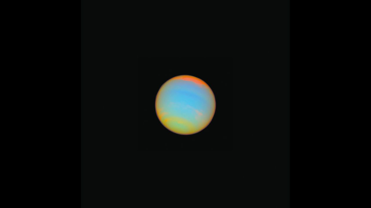 Hubble captured this image of the distant blue-green world Neptune in 2005. Fourteen different colored filters were used to help scientists learn more about Neptune's atmosphere. Neptune is about 2.8 billion miles from Earth.