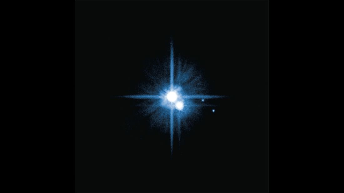 Hubble discovered four of Pluto's five moons. In 2005: Nix and Hydra were found. Hubble discovered Kerberos in 2011 and Styx in 2012. The new discoveries joined Pluto's large moon, Charon, which was discovered in 1978. Styx was found by scientists using Hubble to search for potential hazards for the New Horizons spacecraft which will fly by Pluto in July 2015. Pluto is about 2.9 billion miles from Earth.