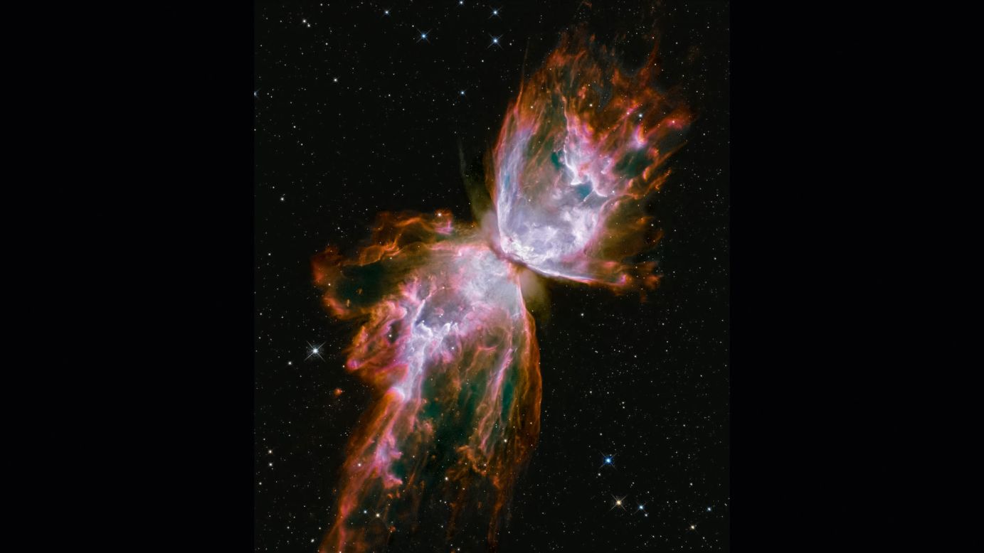 The Bug, or Butterfly Nebula looks like a butterfly with its wings stretching across the galaxy. It's actually a cloud of roiling gas shed by a dying star. Scientists say the gas is more than 36,000 degrees Fahrenheit and is expanding into space at more than 600,000 miles an hour. This image was taken with Hubble's Wide Field Camera 3, a camera installed on Hubble during its May 2009 upgrade by shuttle astronauts. The nebula is about 3,800 light years away in the constellation Scorpius. 
