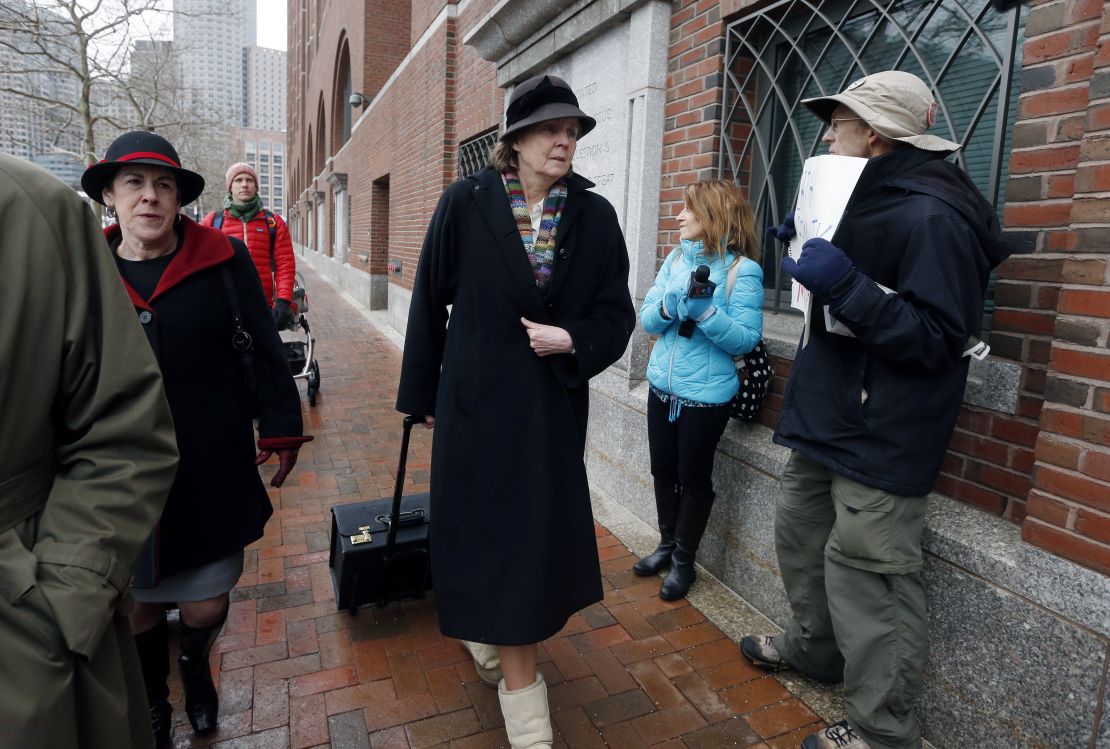 Judy Clarke and other defense attorneys walk past Kerbartas as they arrive at federal court Wednesday.