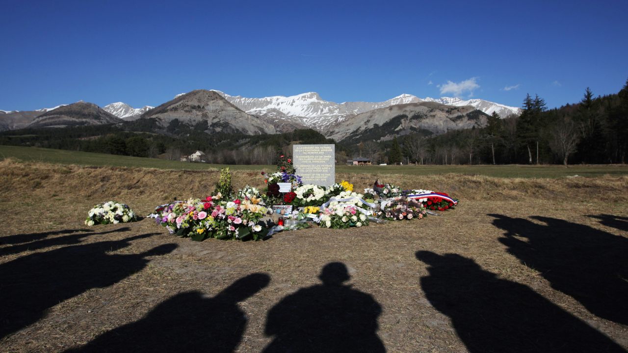People in Le Vernet, France, stand near a memorial site for the victims of <a href="http://www.cnn.com/2015/03/24/world/gallery/france-plane-crash/index.html" target="_blank">Germanwings Flight 9525</a> on Monday, April 6. Flight 9525 was carrying 150 people when it crashed in the French Alps in March.