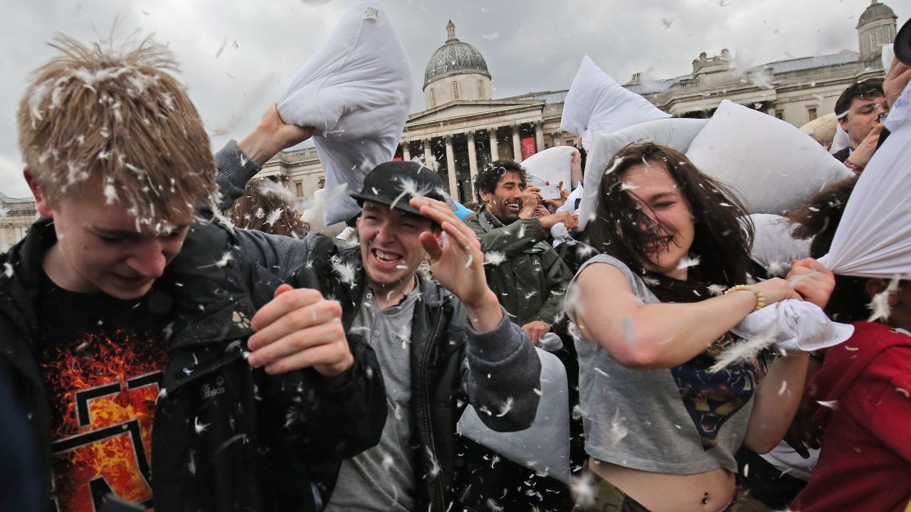 People in London's Trafalgar Square take part in a giant pillow fight on Saturday, April 4. It was International Pillow Fight Day, and similar events were held in other cities around the world.
