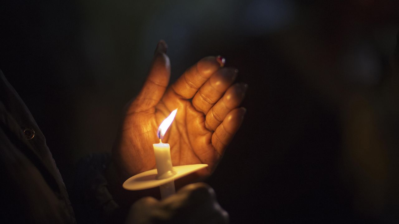 A person holds a candle in North Charleston, South Carolina, during a vigil Wednesday, April 8, for Walter Scott, the unarmed man who was fatally shot by a North Charleston police officer. <a href="http://www.cnn.com/2015/04/03/world/gallery/week-in-photos-0403/index.html" target="_blank">See last week in 35 photos</a>