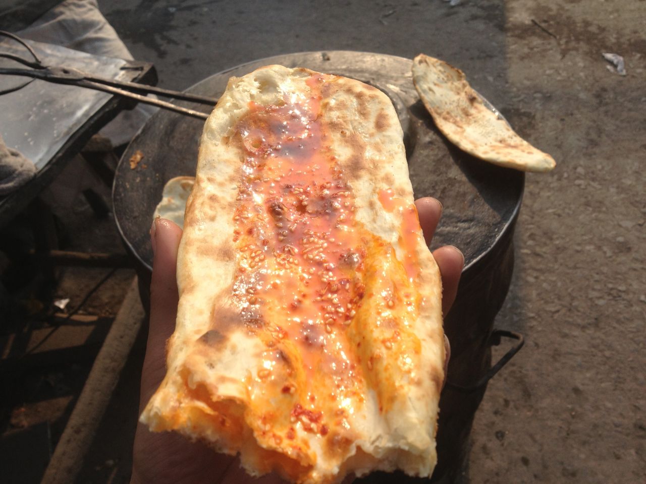 All along the way, Wang relied on inexpensive but hearty street foods, such as this flat bread in Anhui Province.