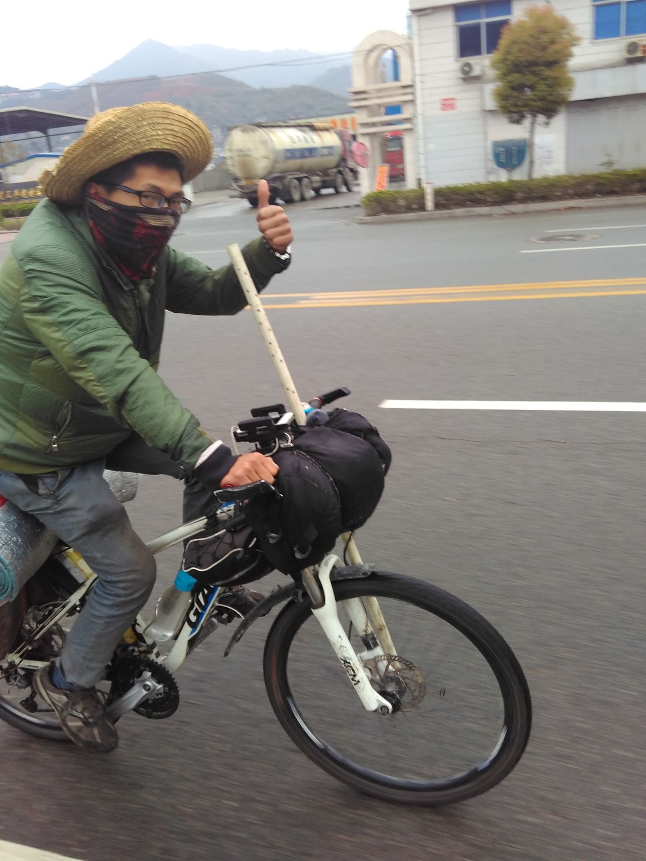 Wang and his bike in Fujian Province, just before heading into Guangdong, where the bike was taken. Wang has spent 460 days covering more than 29,000 kilometers.
