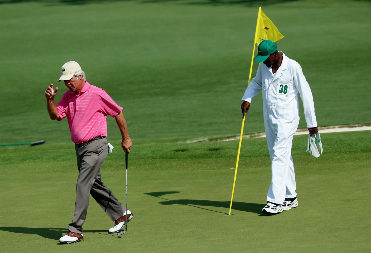 Two-time Masters winner Ben Crenshaw acknowledges the crowd during his final appearance at Augusta. The 63-year-old's longtime Augusta caddy Carl Jackson is at his 53rd and last Masters, having been on the bag with Crenshaw at the tournament since 1976. Crenshaw shot 19-over 91 -- four off the worst in this major.