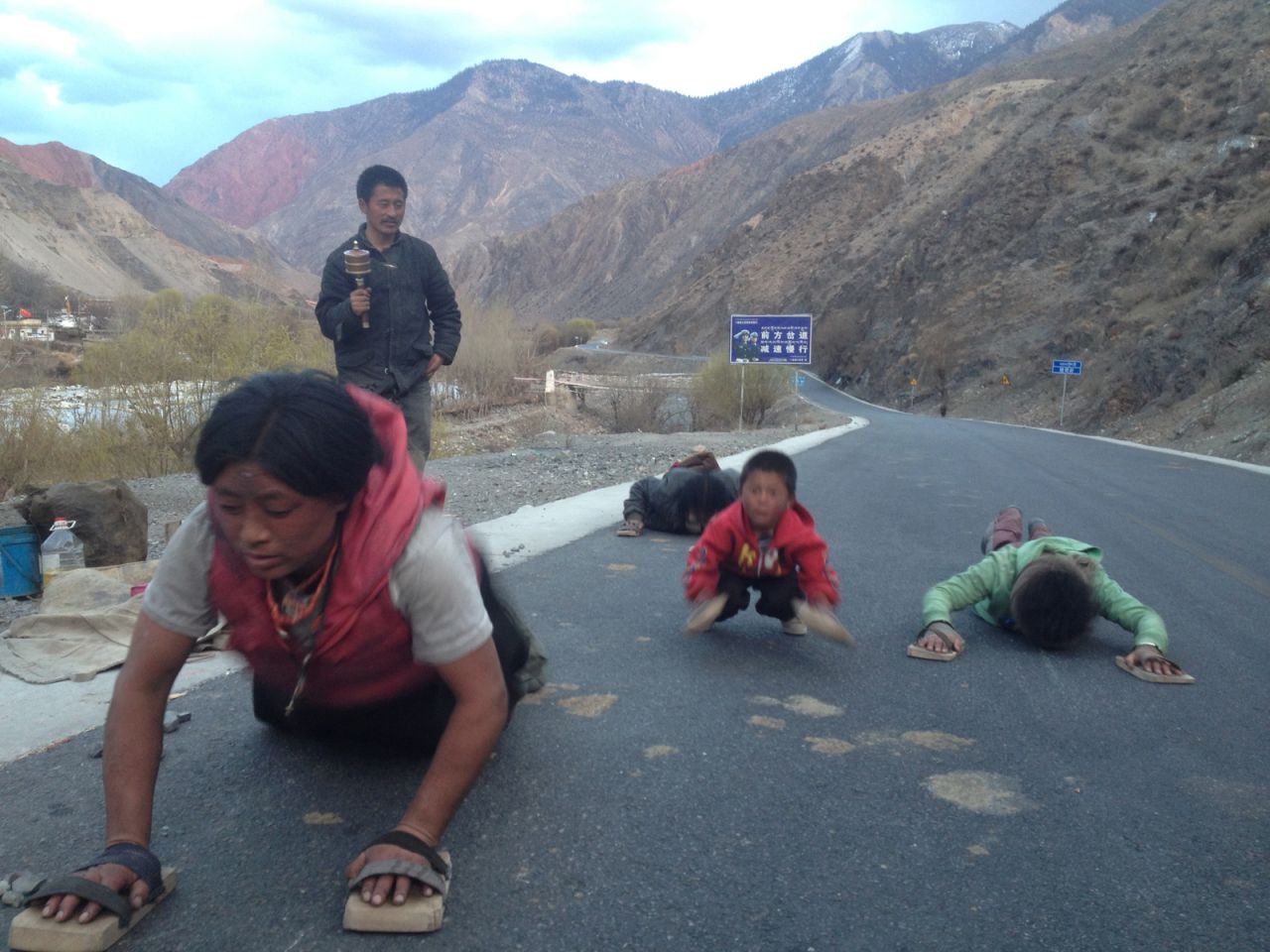 Wang encountered Tibetans performing a traditional long-distance prostration pilgrimage. Now that his bike has been stolen, Wang had vowed to finish his own journey on foot had the bike not been recovered.