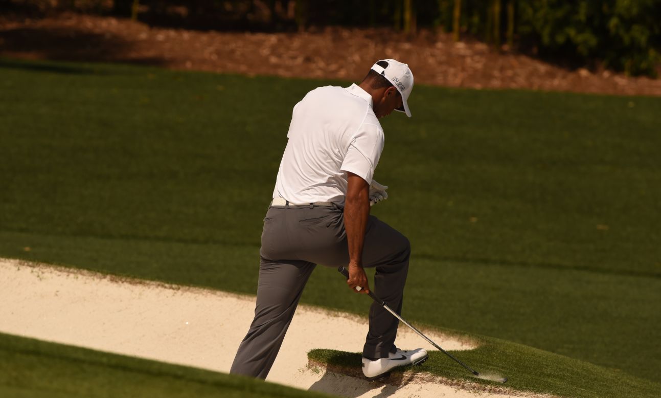 Woods, whose last Masters success was back in 2005, climbs out of a bunker at the fourth hole -- where he dropped another shot. The 39-year-old got back to level par with a birdie at the eighth.