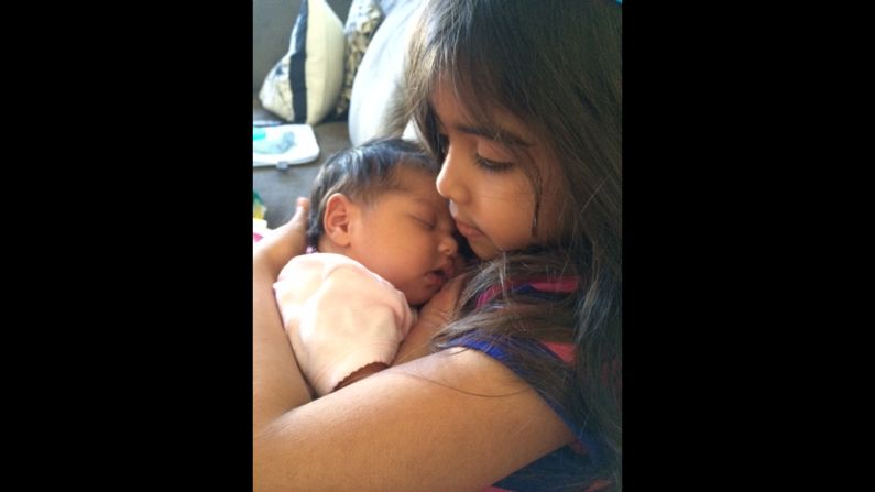 "Josie was so proud to be this baby's big sister. She stared at her and held her like she never wanted to let go." -- <a href="http://ireport.cnn.com/docs/DOC-1231979">Justine Collado</a>, Prince William County, Virginia