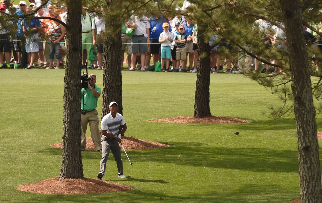 Woods, who won the last of his 14 major titles in 2008, struggled off the tee on the front nine but this superb shot from behind a tree helped him save par on the seventh hole. He continued to scramble and ended the day tied for 41st on 73.