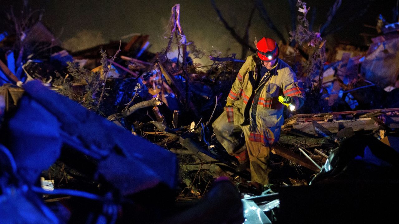 A rescue worker searches through wreckage after a tornado came through Fairdale, Illinois, on Thursday, April 9. <a href="http://www.cnn.com/2015/04/10/us/severe-weather/index.html" target="_blank">As many as 14 tornadoes</a> were reported in the rural Midwest.