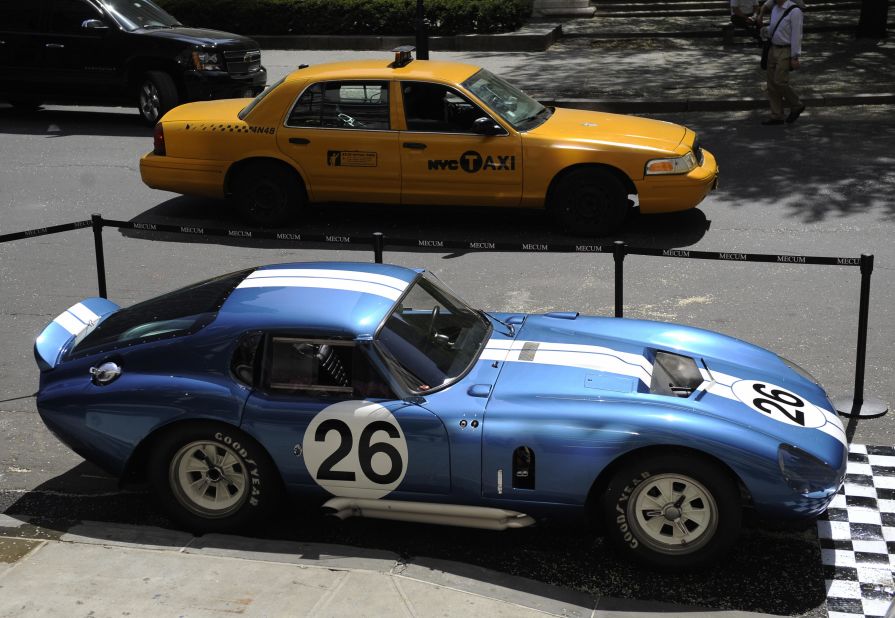 The Shelby Daytona Cobra Coupe with chassis number CSX2601 stands on display in front of New York's Plaza Hotel, during an auction preview. This particular car earned the points needed to secure the 1965 World Manufacturers Championship.