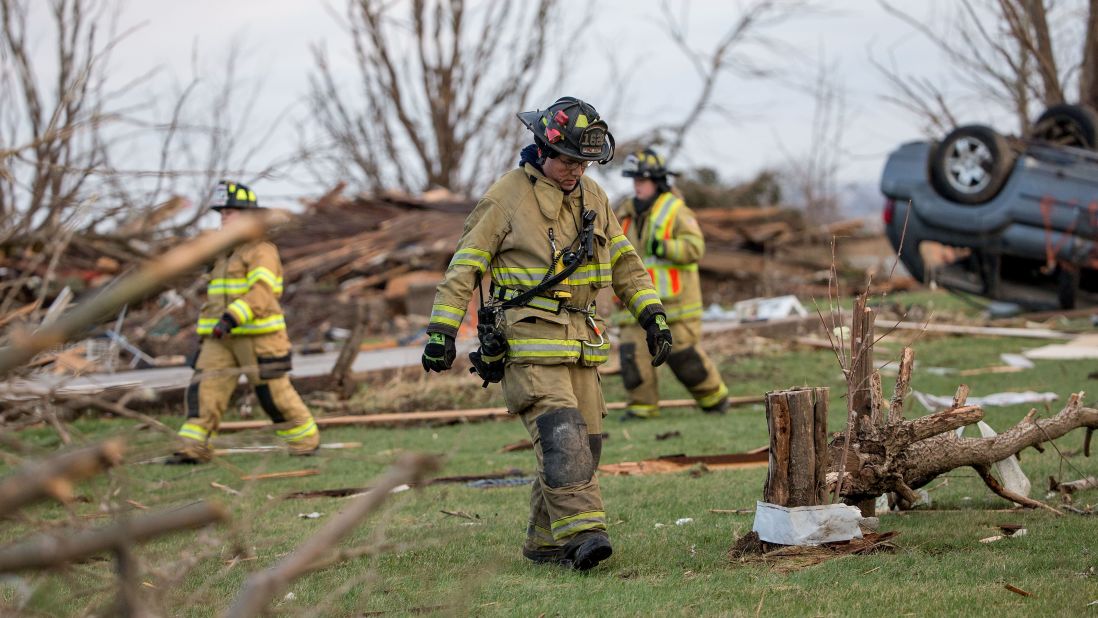 Firefighters search for unaccounted people on Friday, April 10, a day after a tornado swept through Fairdale, Illinois. Geraldine M. Schultz, 67, was killed when the tornado tore through town, according to Dennis Miller with the DeKalb County coroner. As many as 14 tornadoes were reported in the rural Midwest on Thursday.