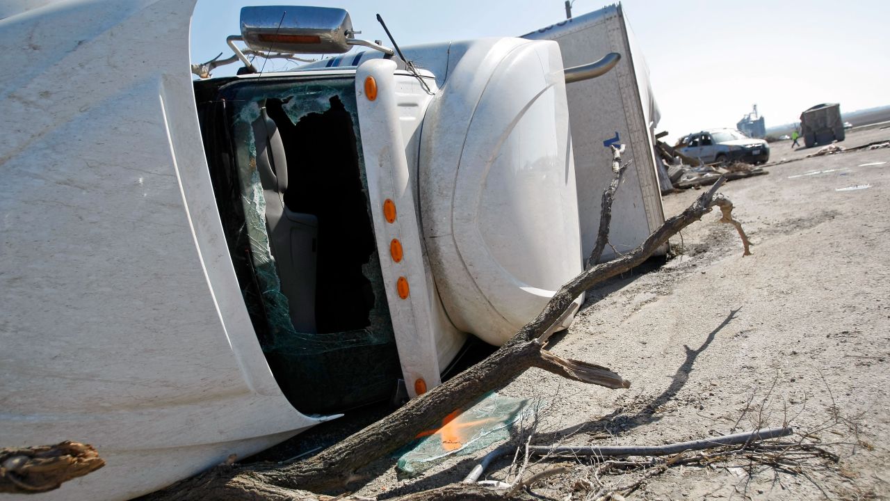 A tractor-trailer lies on its side April 10 in Rochelle, Illinois. It was knocked over while parked the previous night.