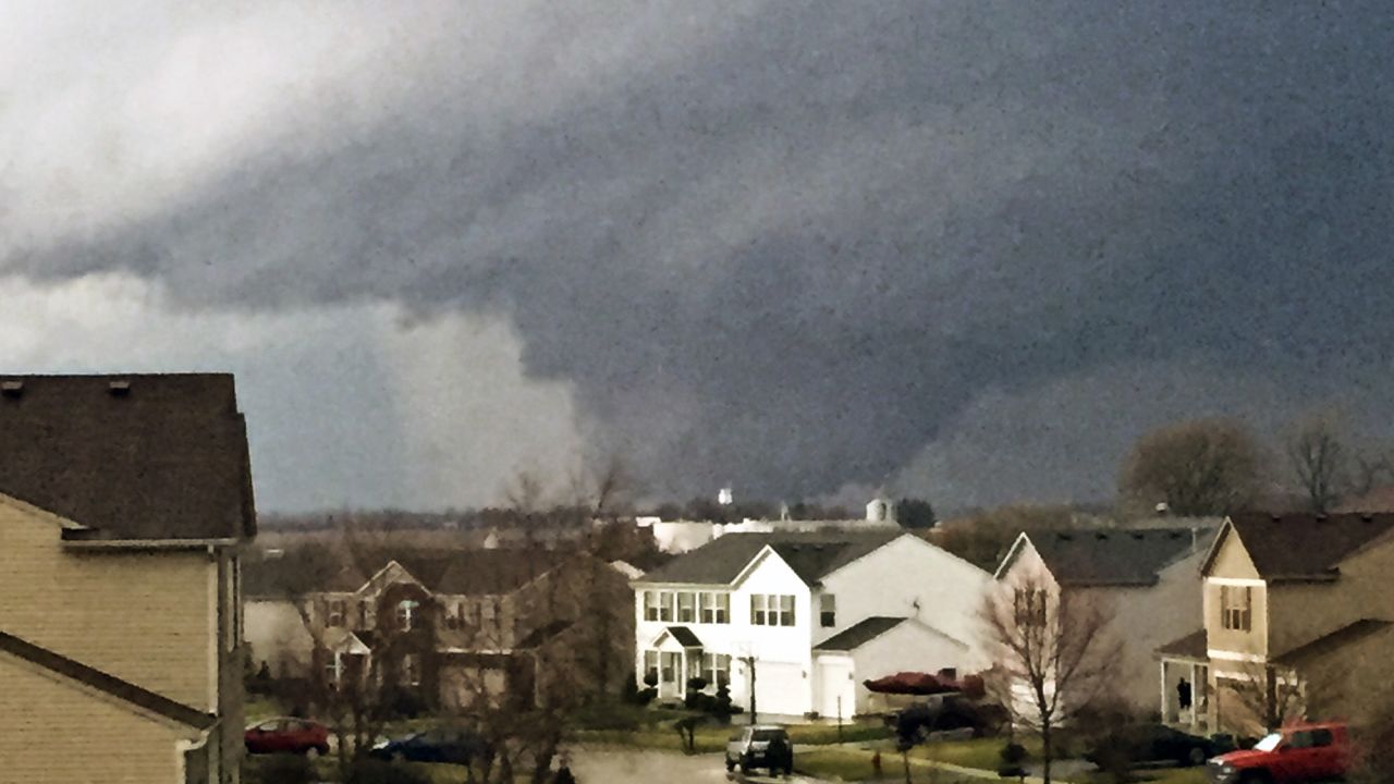 A tornado is seen from a home in Kirkland, Illinois, on April 9.