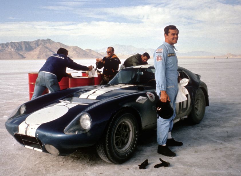 American race car driver, Craig Breedlove, stands beside the CSX2287 on the Bonneville Salt Flats, in November 1965.