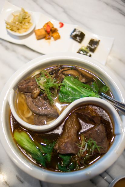 The unique "double flavored beef soup," with both spicy and clear broths, is served in a yin-yang shaped bowl.